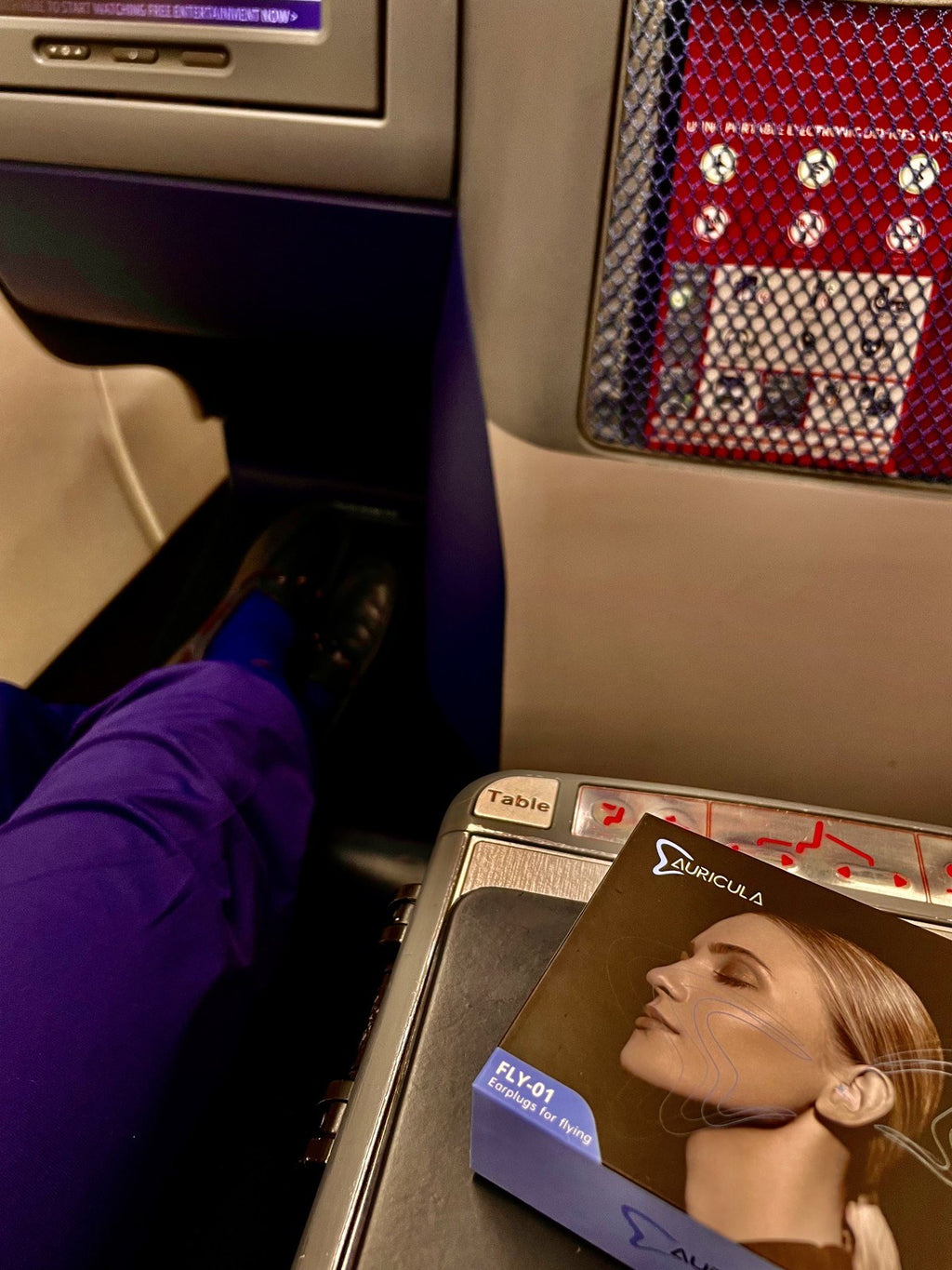 Auricula Air box on an airplane tray table